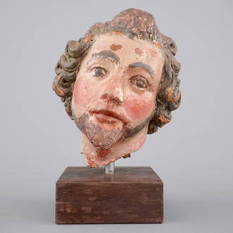 A painted terra cotta head of a saint, probably German, 18th C.